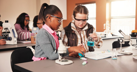 Children, science and girls in school with chemical or teamwork for testing, chemistry and research....