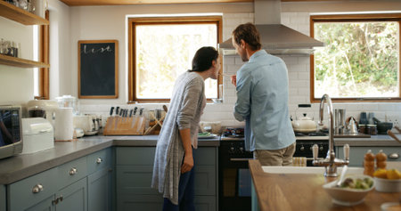 Couple, cooking and feeding woman in kitchen at house for organic ingredients, meal prep and healthy lunch. People, taste and food recipe for nutrition salad, vegan wellness and bonding for culinaryの写真素材