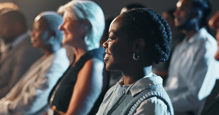Business people, audience and woman with smile at conference for finance training, listening and...