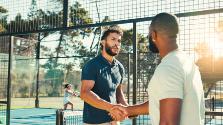 Handshake, coach and tennis with men, fitness and support with competition, contest and practice. Intro, athlete and healthy players with congrats, shaking hands and sports with teamwork for gameの写真素材