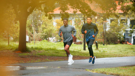 Friends, fitness and men running in road for marathon training, wellness competition or cardio...