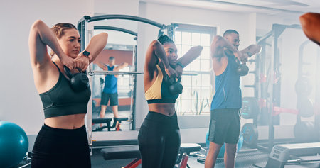 Workout, exercise and kettlebell with personal trainer, class and gym for training or fitness...