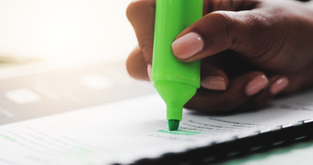 Office, documents and hands of person with highlighter for notes on proposal, report and contract. Professional, edit and worker with marker on paperwork for proofreading, review and inspectionの写真素材