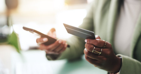 Business woman, hands and phone with credit card for online shopping, banking purchase and rewards password. Closeup, employee and smartphone for ecommerce, internet payment and website subscriptionの写真素材