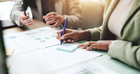 Hands, business people and sticky note with feedback, graphs and profit growth or sales analytics. Closeup, teamwork and financial advisor with proposal, advice or ideas for charts or company revenueの写真素材