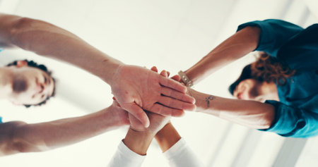 Stack of hands, collaboration and doctor with nurses in hospital for celebration, achievement or...