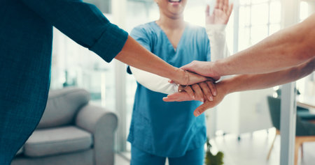 Stack of hands, celebration and doctor with nurses in hospital for collaboration, achievement or...