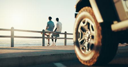 Adventure, road trip and travel with friends at beach together for bonding, holiday or vacation. Relax, thinking and transport with people outdoor on coast for getaway, view or weekend from backの写真素材