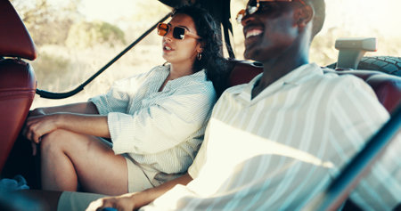 Travel, road trip and drive with couple in nature for safari game reserve, adventure or summer vacation. Explore, savannah holiday and conservation with people in car for national park or eco tourismの写真素材