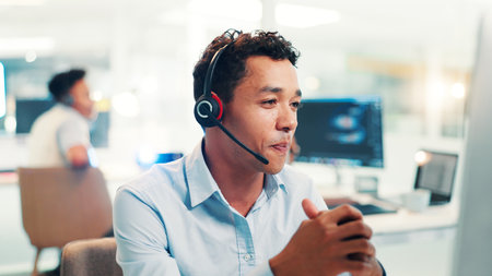 Headset, man and call center agent in office for communication, contact us or networking. Technology, crm and male technical support consultant with online consultation for helpdesk in workplace.の写真素材