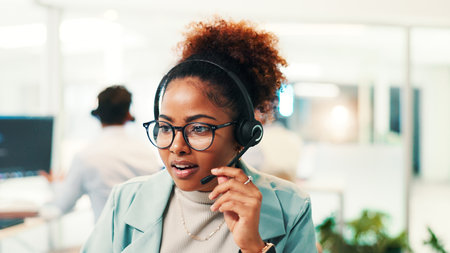 Headset, woman and technical support agent in office for communication, contact us or networking. Technology, crm and female call center consultant with online consultation for helpdesk in workplace.の写真素材