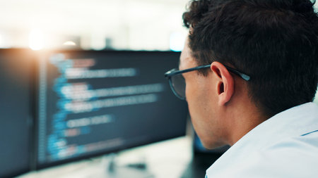 Coding, man and computer screen with reading in office for software development, website maintenance...