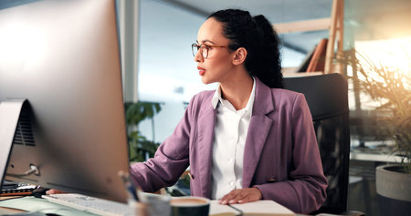 Research, notebook or woman on computer in office for online project, review or economy website....