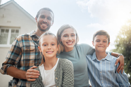 Happy family, portrait and outdoor hug for love, garden and bonding together in Scotland. Parents, support and embrace children for security in relationship, kids and trust in backyard of homeの写真素材
