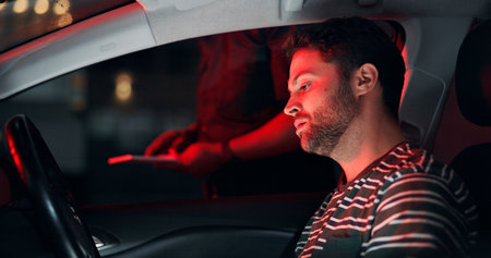 Man, police and stop driver for traffic check, registration and speeding warning. Person, law enforcement and licence search for drunk driving, fine penalty and transport risk for violation at nightの写真素材