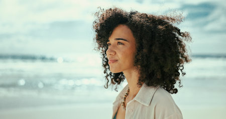 Thinking, reflection or woman at ocean for holiday, vacation, outdoor travel or adventure to relax. Beach, break or person with peace at sea for trip, mindfulness or tourism ideas on island in Baliの写真素材