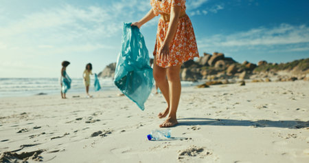 Hands, plastic bottle and volunteer at beach for pollution, bag and accountability with dirt in...