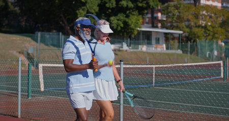 Tennis court, friends and mature couple for workout, game or competition. Fitness, sports racket and athlete man with woman ready for training, match and outdoor weekend hobby for health and wellnessの写真素材