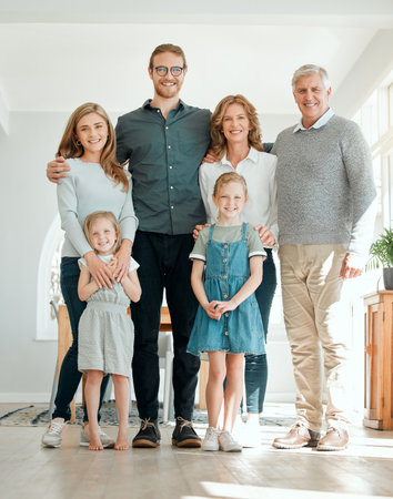 Big family, portrait and happy generations with kids in home for bonding, love or care for sisters. Grandparents, mother and father with children for support, relationship and connection with peopleの写真素材