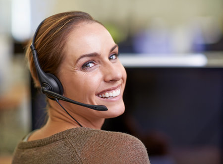 Happy, portrait and consultant in call center for communication in customer service, crm and advice. Professional, woman and telemarketing employee in technical support with feedback for clientの写真素材