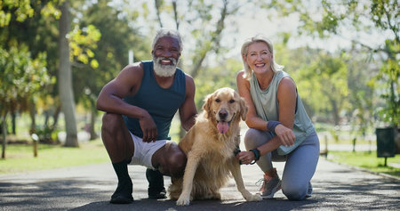 Senior couple, portrait and dog in park with smile, love and care with runner workout and marathon training. Outdoor, health and interracial relationship with pet, animal and golden retrieverの写真素材