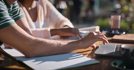 Outdoor, hands and university student with laptop on internet for research, assignment and essay...