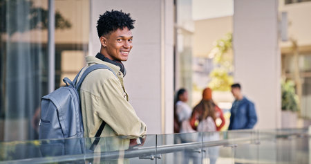 Man, college student and happy outdoor with pride for education, progress and study in Cuba. Male person, university learner and outside with smile on portrait in confidence for learning on campusの写真素材