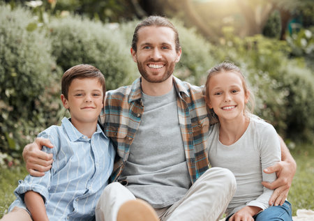 Father, portrait and garden hug with children, outdoor love and bonding together in Scotland. Parent, countryside and dad embrace kids for security in relationship, vacation picnic and holiday tripの写真素材