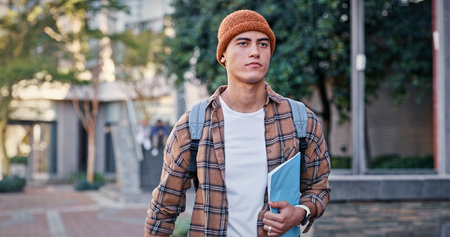Man, morning commute or college student walking to class for learning, future or study in university campus. Travel, leaving or learner with book or confidence for school, education or scholarshipの写真素材