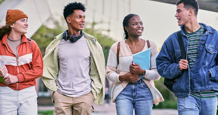 Group, students and outdoor with friends, happy and backpacks for walking on campus or university. People, smile and talking for education, development and scholarship for learning, college or schoolの写真素材