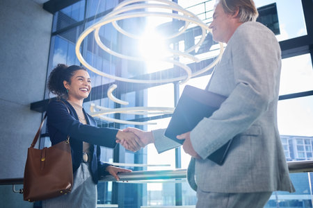 Handshake, woman and man in office, meeting and agreement for job interview, smile and HR with contract. Happy, welcome and employment of person, hiring and professional in agency or broker with fileの写真素材