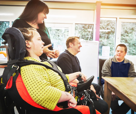 Disability group support meeting with disabled people with handicap in therapy, inclusive and...