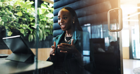 Black woman, business and tablet with booth in office of discussion, schedule update and finance report. Accountant, person and proposal video call for feedback, investment offer and negotiationの写真素材