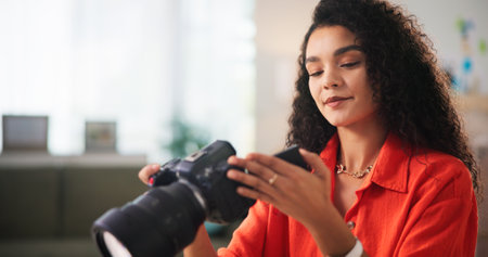 Woman, photographer and camera with capture for editing, retouch or online content creation. Female person, freelancer or remote worker with technology or lens for picture quality or small businessの写真素材