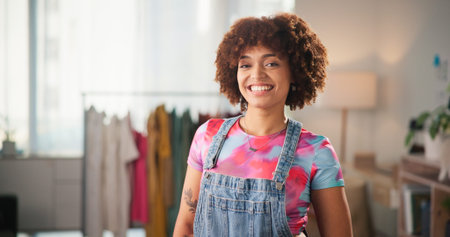 Happy woman, portrait and fashion designer with afro for small business or clothing design at home....