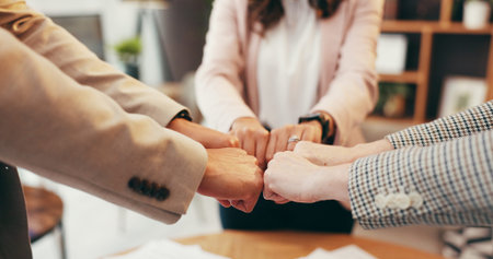 Team, hands and business people with fist bump in office for support, mission or motivation for...