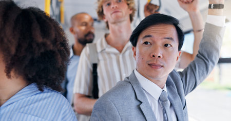 Business, commute and thinking with Asian man on bus for public transportation to work destination. Idea, travel and waiting with corporate employee on coach or shuttle for morning journey to jobの写真素材