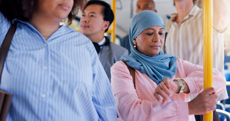Travel, woman and check watch on bus for traffic delay, morning commute and late for appointment. Passenger, mature person and time on public transport for meeting deadline, schedule and ride journeyの写真素材