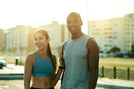 City, couple and portrait with love for fitness, wellness and health benefits with training journey. Dating people, woman and man with bonding for exercise, workout progress and relationship outdoorの写真素材