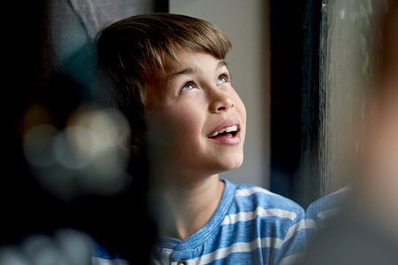 House, window and boy with ideas, thinking and daydreaming with view, smile and happiness....