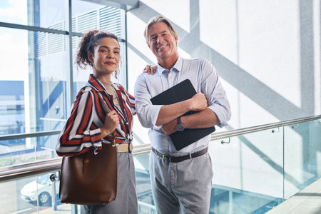 Internship, manager and portrait of happy people in training, meeting and workshop in office for learning. Face, smile and working in company with team, mentor and partnership in business law firmの写真素材
