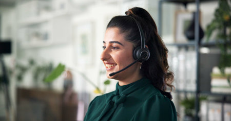 Callcenter, woman and smile with headset in office, CRM or communication for customer service or...