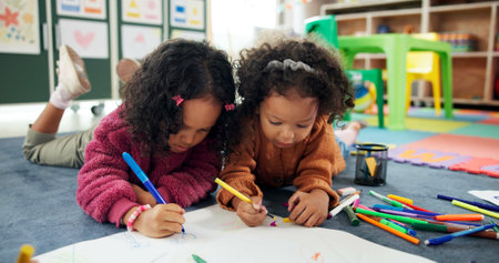 Color, friends and drawing with girls in classroom for child development, artwork and creative project. Youth, academy and growth with students at school for knowledge, learning and kindergartenの写真素材