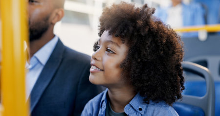 Travel, happy and kid with father in bus for morning commute, journey and trip to school together. Smile, dad and boy in public transport with passenger for transit service, thinking and visionの写真素材