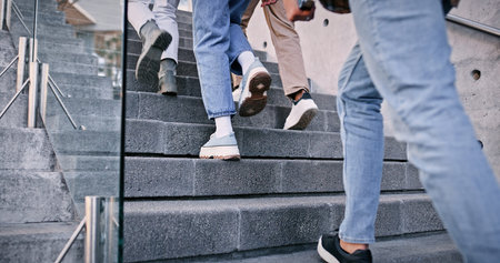 Feet, students and walking on stairs at school for education, learning break and studying of classroom lesson. People, legs and steps for knowledge, university and travel for morning path outdoorの写真素材