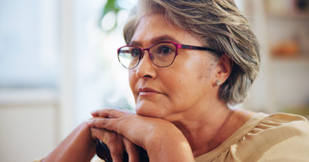 Thinking, elderly woman and relax at house for reflection, loneliness and nostalgia for past memory....