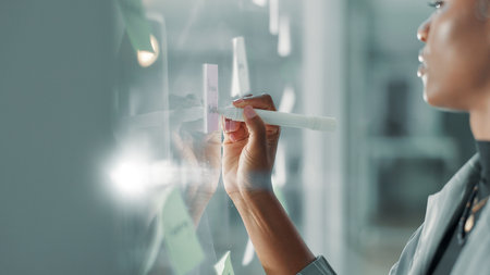 Business woman, sticky note and writing by glass with mission, ideas or strategy for financial planning. Research, information or checklist for budget, funding or finance solution with agendaの写真素材