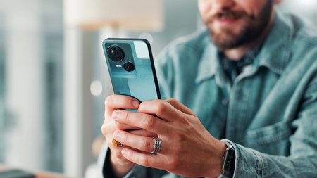 Hands, business person and typing on phone with internet connection for networking, communication or...
