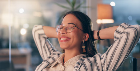 Woman, relief and happy in office for finished job, target or night with project approval at startup...
