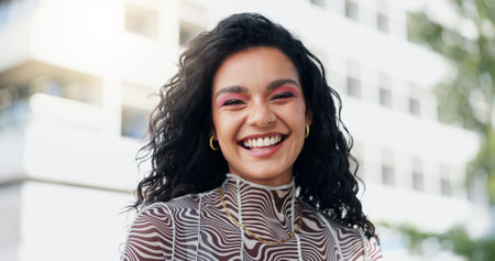 Happy, fashion and portrait of woman in city with makeup, streetwear or trendy clothes. Smile, confident and female person with facial cosmetics and stylish, edgy or casual outfit in urban town.の写真素材